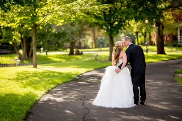 A newly married couple walking through Heritage Park