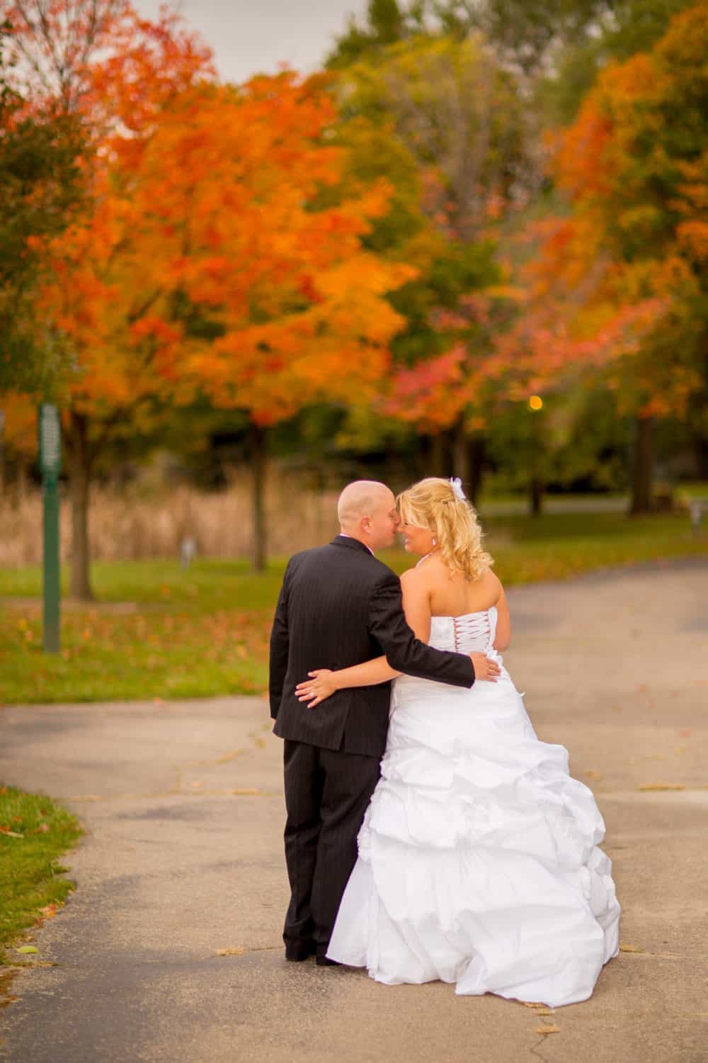 A newly married couple in the autumn landscape